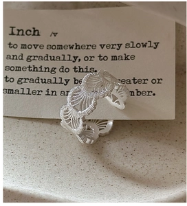 Detailed close-up of S925 sterling silver ring with delicate lace texture and matte finish