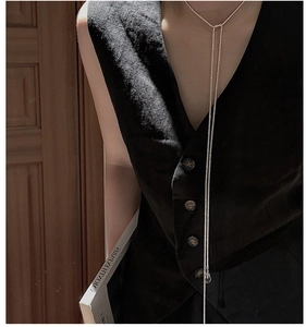 Silver Y-necklace featuring a water drop crystal pendant worn on a model for a stylish look