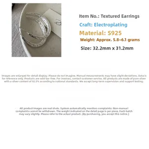 Detailed macro view of S925 sterling silver hoop earrings with vintage hammered texture
