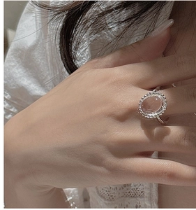 Detail of S925 sterling silver ring featuring a retro oval crystal with beaded bezel edge
