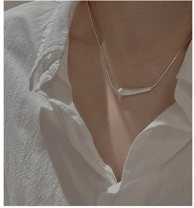 Detailed view of S925 sterling silver minimalist necklace with brushed bullet pendant