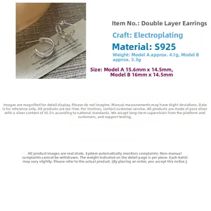 Macro view of S925 sterling silver double-layer earrings with polished plated finish