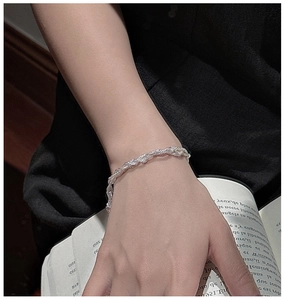 Close-up of S925 sterling silver multilayer twisted chain bracelet on a hand