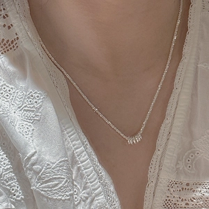 Minimalist S925 sterling silver necklace with interlocking circles on a model