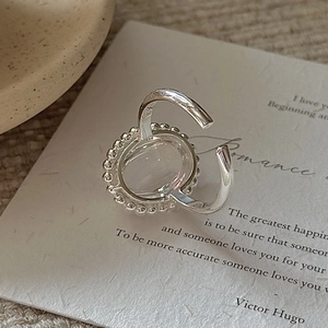 Vintage S925 sterling silver open ring with oval white crystal and beaded frame