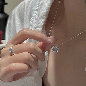 Minimalist S925 silver jewelry set with light blue gemstone necklace and ring on model