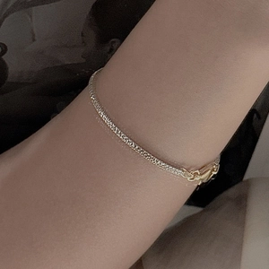 Minimalist S925 sterling silver snake chain bracelet with textured finish on wrist
