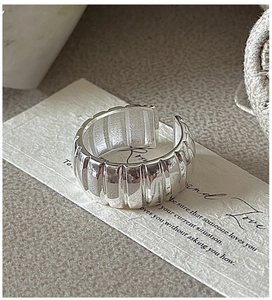 Macro view of wide vintage S925 sterling silver ring with vertical pleated texture