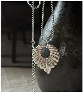 Detailed view of S925 sterling silver hollow pendant with textured radial finish