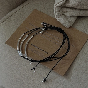 Three-piece S925 sterling silver tube minimalist cord bracelets on vintage card
