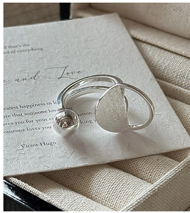 Close-up of S925 sterling silver ring with brushed texture and polished sphere detail