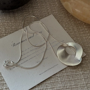 Minimalist S925 sterling silver necklace with matte twisted pendant and snake chain