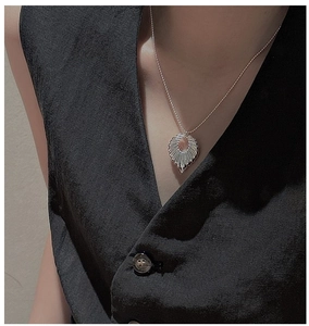 Close-up of S925 silver retro necklace with amber gemstone pendant and textured bead chain
