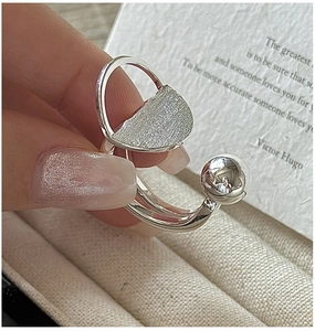 Detail of S925 sterling silver ring with brushed texture and minimalist geometric design