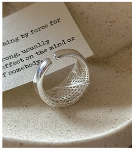 Close-up of S925 sterling silver wide ring featuring intricate 3D grid texture details