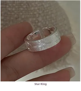 Macro shot of S925 sterling silver brushed star ring featuring a sparkling zircon stone