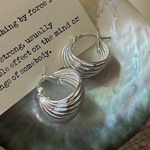 Elegant S925 sterling silver hoop earrings featuring a multi-layer woven texture on shell