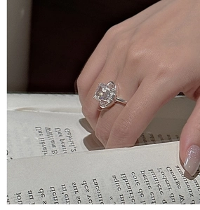 Detail of S925 silver ring with large rectangular crystal and sparkling halo setting