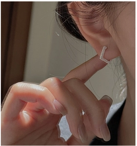 Close-up of S925 silver geometric square hoop earrings set with sparkling zircon stones