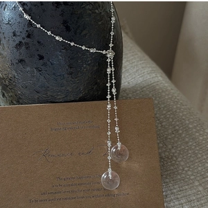Detail of S925 silver Y-shaped tassel necklace with pink crystal drops on vintage card