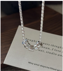 Close-up of S925 sterling silver popcorn chain necklace with five polished beads