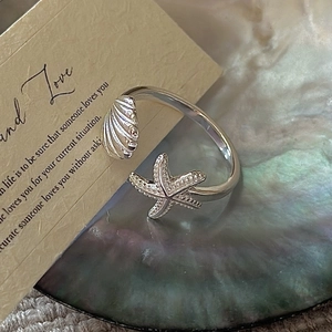 Elegant S925 sterling silver open ring featuring a seashell and starfish design