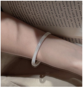 Detailed view of an S925 silver mesh bracelet featuring a fine woven texture on a wrist