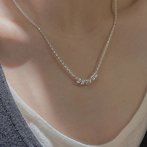 Minimalist S925 sterling silver popcorn chain necklace with cylindrical pendants on model