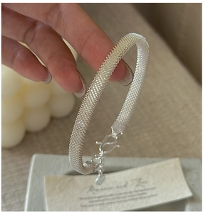 Detail of S925 sterling silver mesh woven bracelet with classic S-shaped buckle