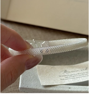 Detail view of S925 silver woven mesh bracelet showing intricate texture and clasp