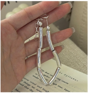 Detailed close-up of S925 sterling silver hollow bamboo link bracelet on hand