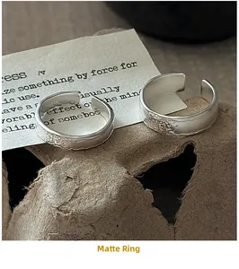Macro view of S925 sterling silver rings with matte hammered texture and S925 hallmark