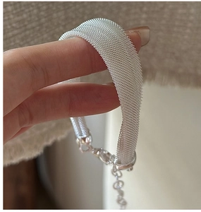 Detailed view of the S925 sterling silver mesh bracelet texture and lobster clasp