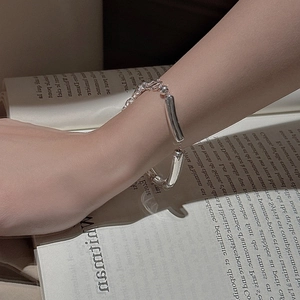 Minimalist S925 sterling silver hollow bamboo link bracelet on woman's wrist