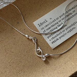 Minimalist S925 sterling silver snake chain necklace featuring a geometric twist buckle