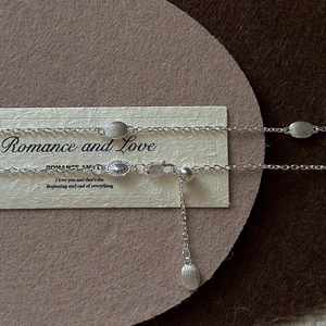 Minimalist S925 sterling silver bean necklace with brushed metallic texture and O-chain