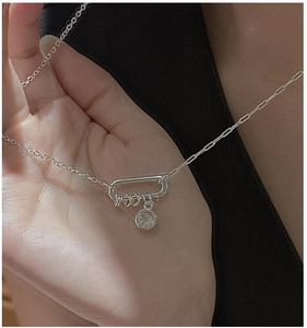 Detail of S925 sterling silver necklace with paperclip chain and zircon pendant