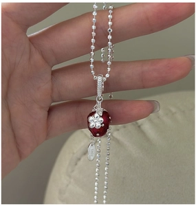 Close-up of S925 sterling silver strawberry pendant with enamel and S925 hallmark