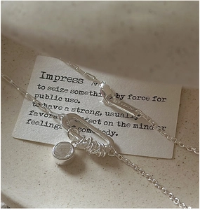 Macro shot of S925 sterling silver chain with U-shaped clasp and clear zircon stone