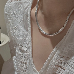 Minimalist S925 sterling silver bamboo tube necklace on model with lace top