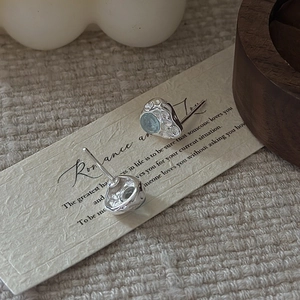 S925 sterling silver earrings with textured finish and light blue aquamarine gemstone