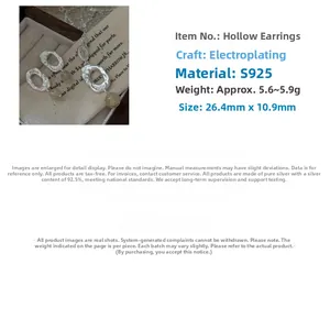 Detail of S925 sterling silver hollow earring with rutilated quartz bead and matte finish