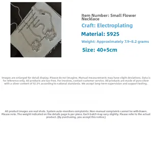 Macro detail of S925 sterling silver flower necklace pendant with floral engraving