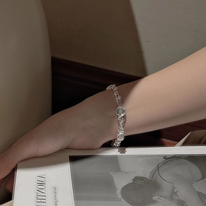 S925 sterling silver multilayered woven bracelet with geometric charms on wrist
