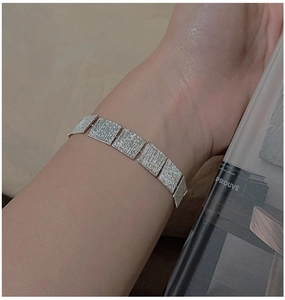 Close-up of S925 sterling silver bracelet featuring minimalist brushed rectangle links