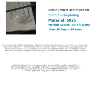 Macro shot of S925 sterling silver hollow heart pendant with grid texture and 18.5mm size
