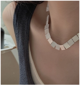 Detailed view of S925 sterling silver rectangle sequin chain necklace on neck