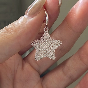 Minimalist S925 sterling silver 3D mesh star pendant featuring a woven wire hollow design