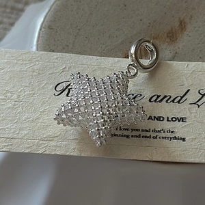 S925 sterling silver hollow woven star pendant with a minimalist 3D mesh design for women