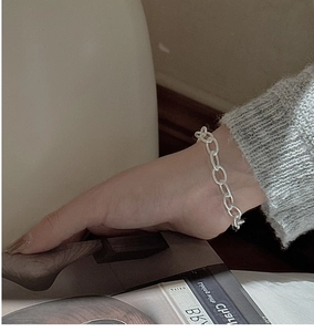 Close-up of 925 sterling silver chunky beaded bracelet on a model's wrist